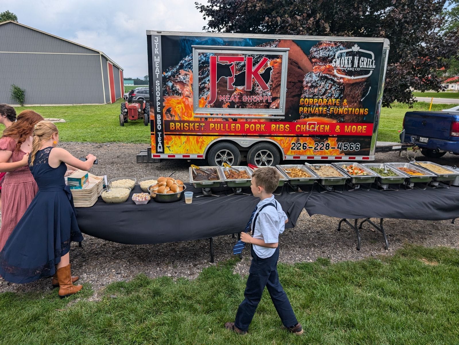 Outdoor catering setup by Smoke N Grill and JTK